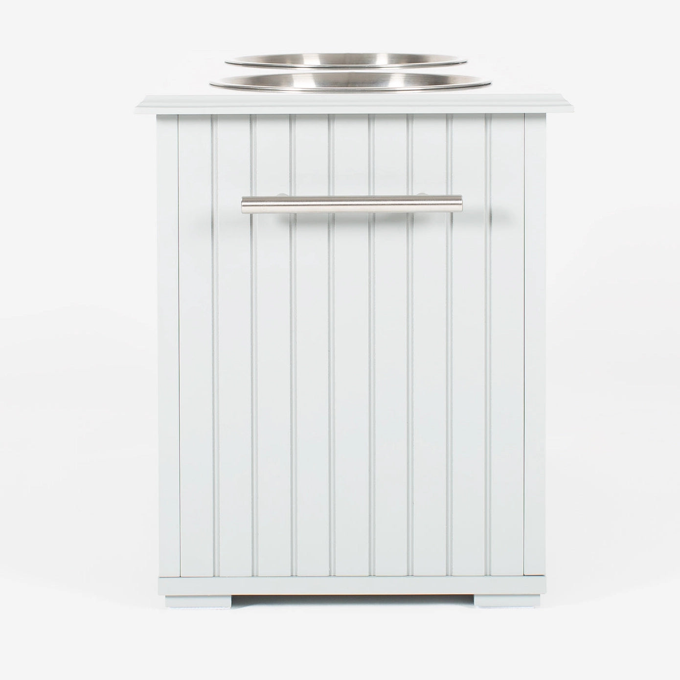 Station alimentaire blanche avec deux bols en acier inoxydable, conçue pour stocker et servir la nourriture et l’eau de manière hygiénique.
